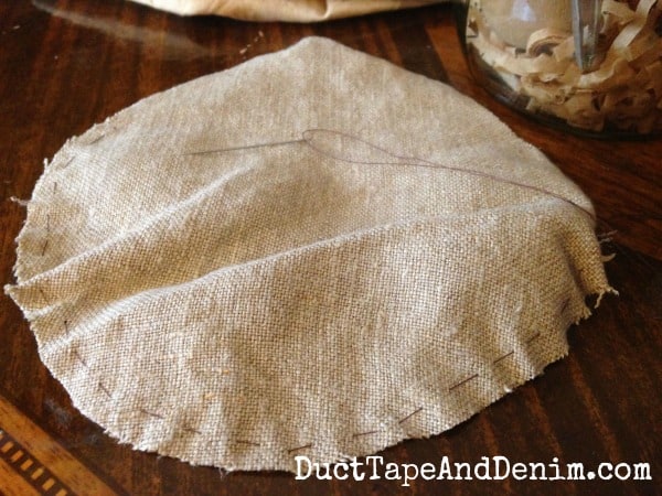 Vintage linen made the top of my Anthropologie inspired mason jar pin cushion | DuctTapeAndDenim.com