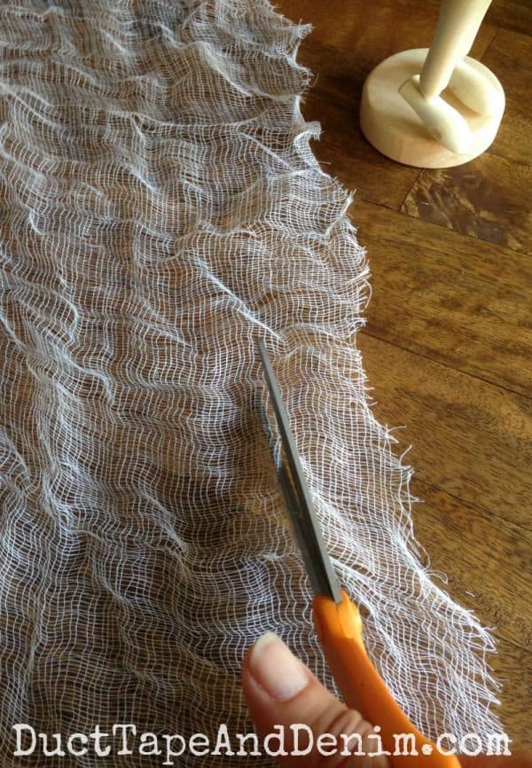 Cut cheesecloth into strips for my Halloween mummy model DIY | DuctTapeAndDenim.com