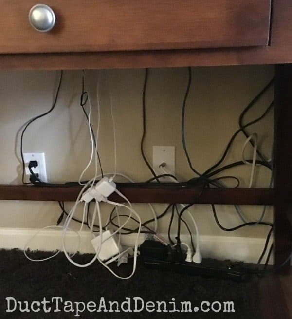 What hubby's desk looked like before we learned how to hide cords | DuctTapeAndDenim.com