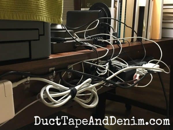 How we hid cords behind desk | DuctTapeAndDenim.com