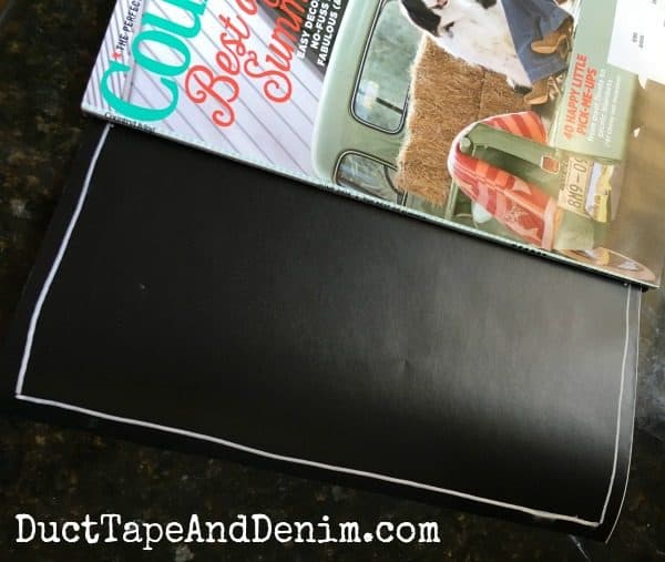 I used a magazine as a ruler to draw lines between the days on my meal planner | DuctTapeAndDenim.com