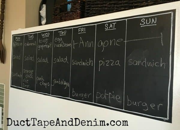 My completed chalkboard meal planner on the fridge | DuctTapeAndDenim.com