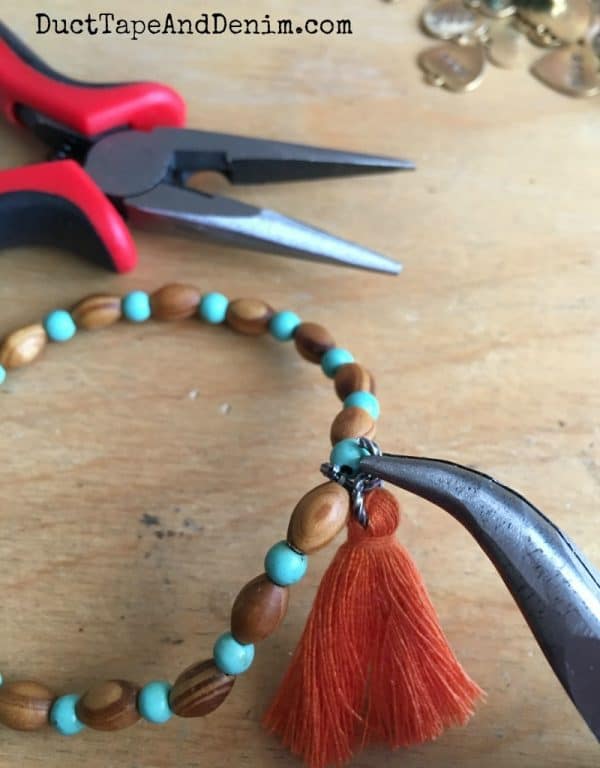 Adding tassel to bracelet | DuctTapeAndDenim.com