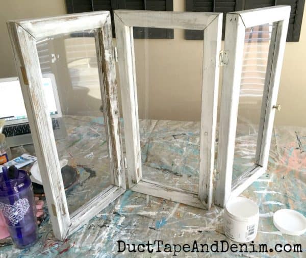 3 upcycled thrift store windows hinged together, start of jewelry display