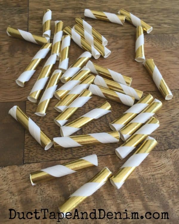 Cut straws with scissors to make paper straw garland | DuctTapeAndDenim.com