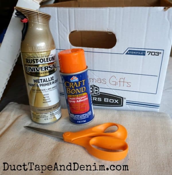 Supplies for covering file box with drop cloth. Tutorial on DuctTapeAndDenim.com