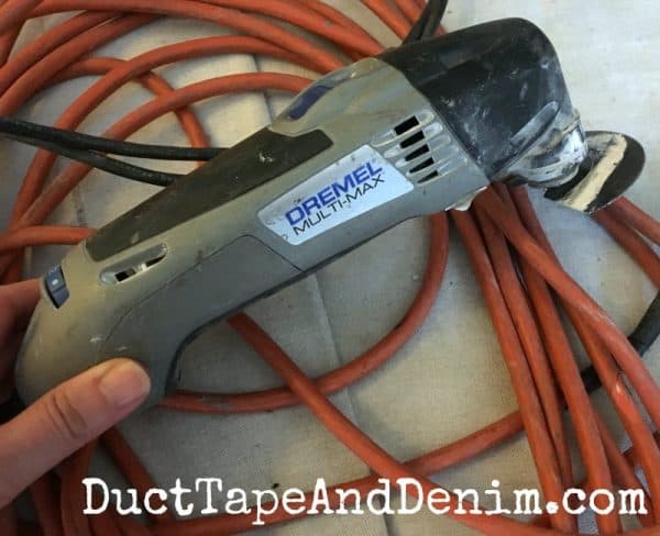 We used a Dremel Multi-Max to cut our laminate flooring | DuctTapeAndDenim.com