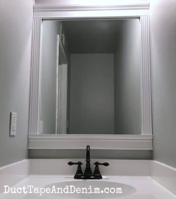 AFTER - Our finished DIY mirror frame, in our small bathroom or powder room. See all our projects from this room on DuctTapeAndDenim.com copy 2
