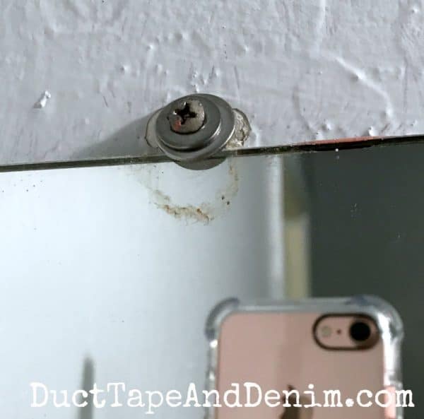Used washers as mirror clip for frame | DuctTapeAndDenim.com