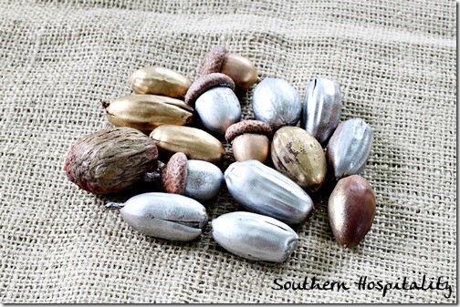 metallic spray painted acorns and nuts for fall decor
