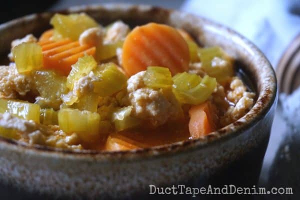 Ground chicken soup, carrots, celery in brown drip bowl | DuctTapeAndDenim.com