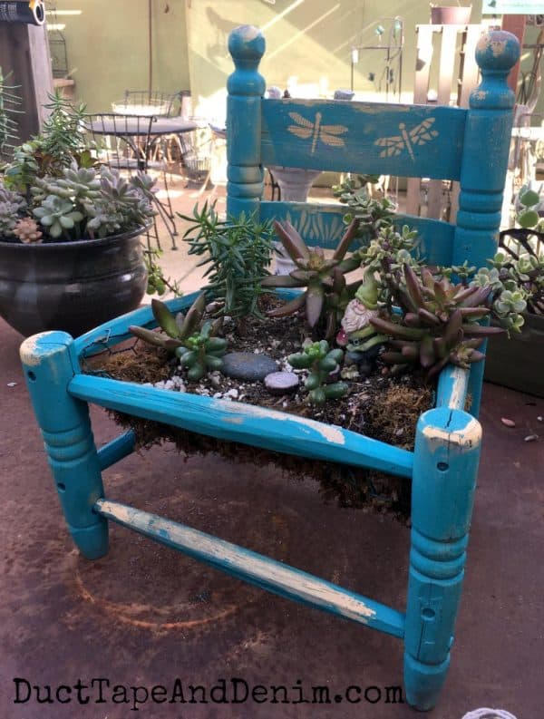 Succulents in old child's chair | DuctTapeAndDenim.com