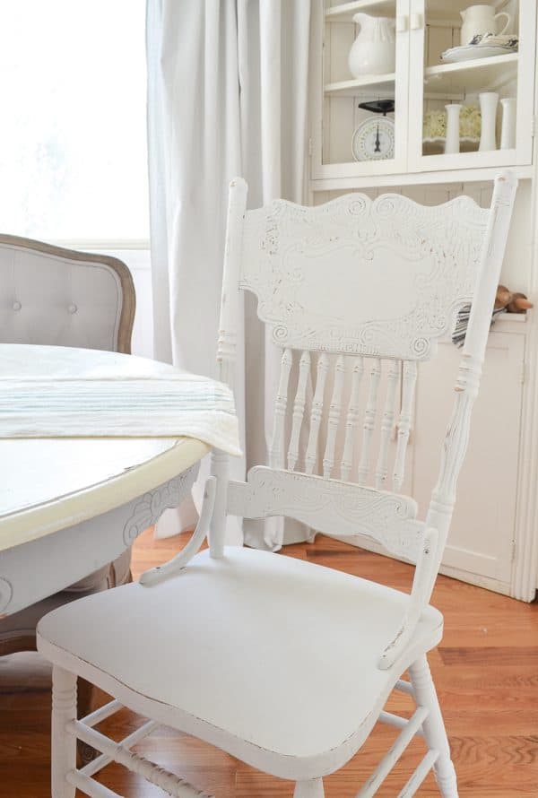 Chalked spray paint on dining chair makeover 