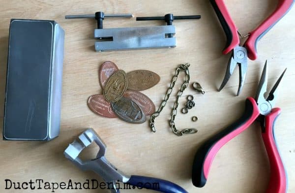 pressed pennies and other supplies and tools to make bracelets