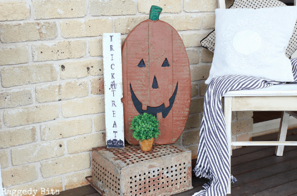 trick or treat and jack o lantern signs on porch