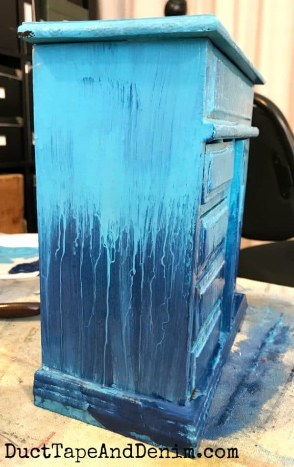 dripping paint on turquoise jewelry cabinet