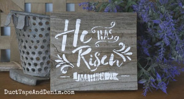 He is Risen stenciled sign with lavender behind