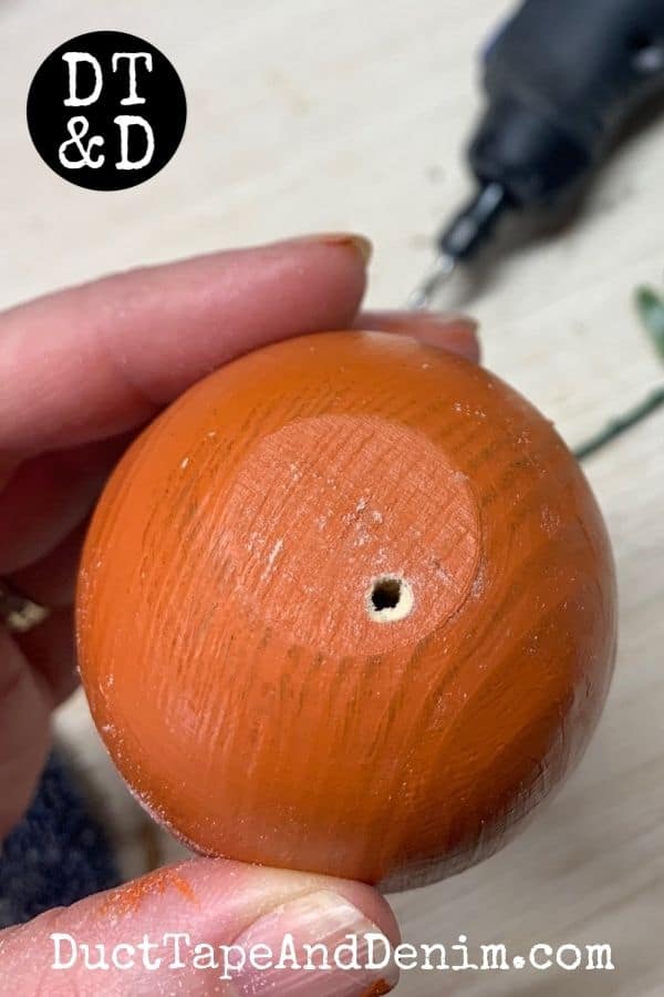 drill holes in top of wood easter egg to add carrot leaves