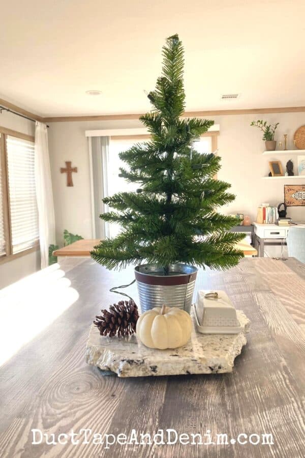mini Christmas tree centerpiece on farmhouse kitchen island